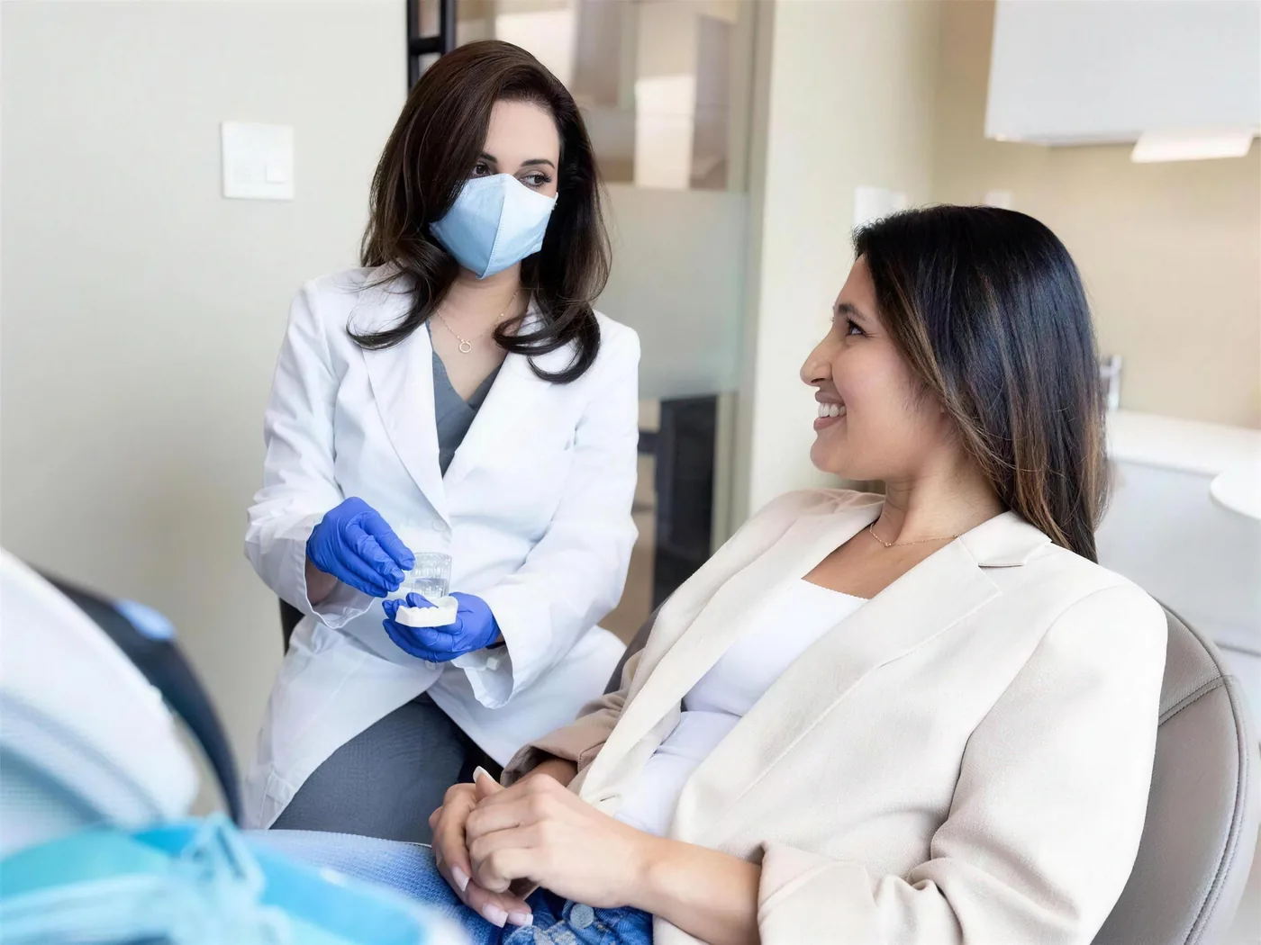 Clinician reviewing a clear aligner plan with a patient at Green Dentistry: Root and Restore in Alexandria, VA