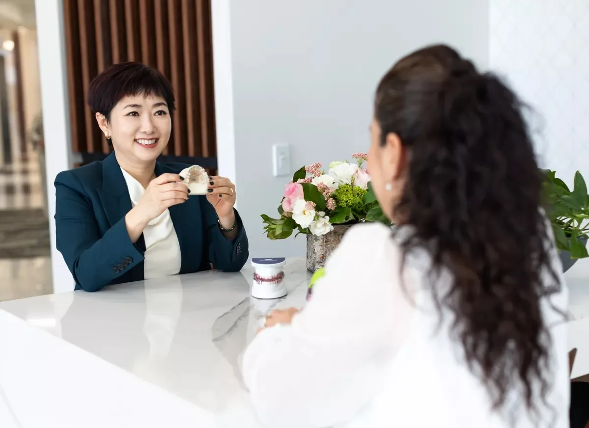 Dr. Hye Park discussing a personalized airway and sleep plan with a patient at Green Dentistry: Root and Restore in Alexandria, VA