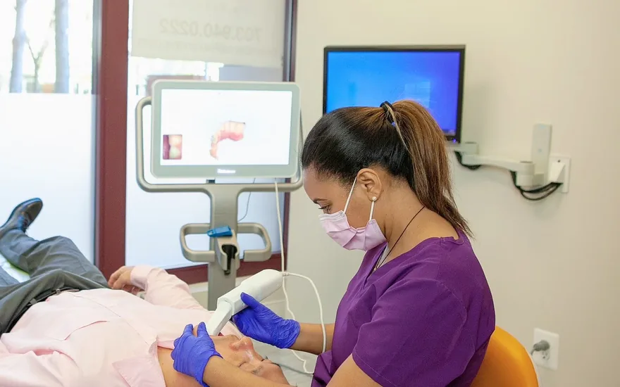 Green Dentistry clinician performing a digital iTero scan during a holistic dental visit in Alexandria, VA