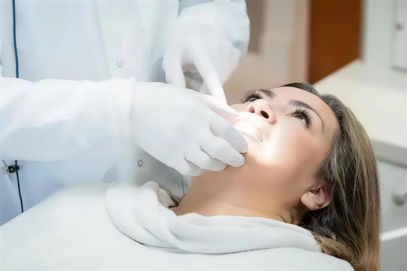 Patient receiving a TMJ and jaw evaluation at Green Dentistry: Root and Restore in Alexandria, VA